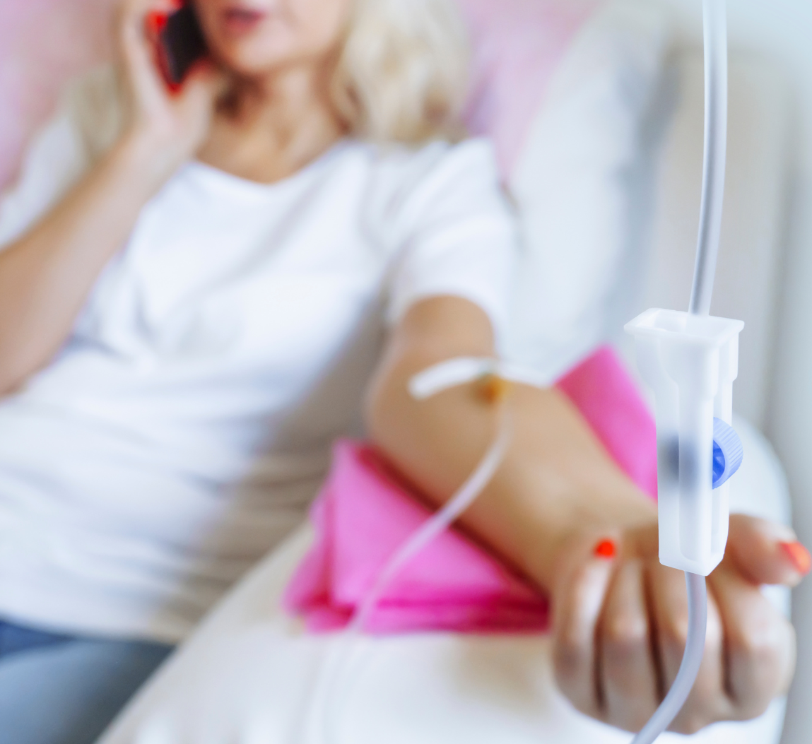 Ketamine IV Patient Close-up of IV therapy in progress with a relaxed patient in the background—representing ketamine infusions, and vitamin therapy at Mind Rejuvenation, Tulsa’s trusted wellness clinic.